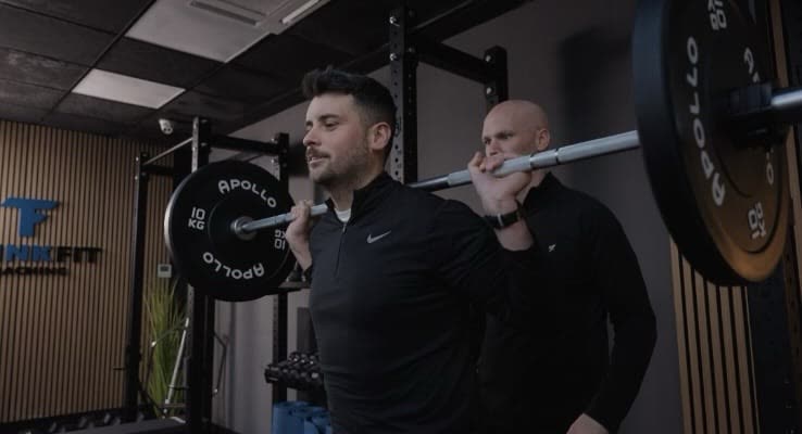 Coaching a client through a lift at ThinkFit Studio Rathfarnham