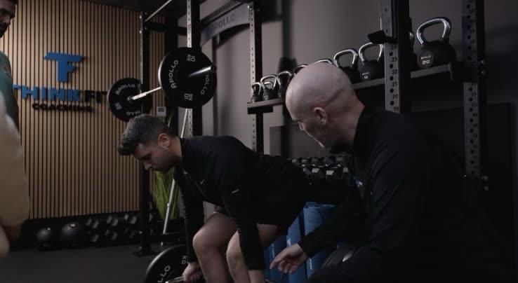 Client training with kettlebell at ThinkFit private studio